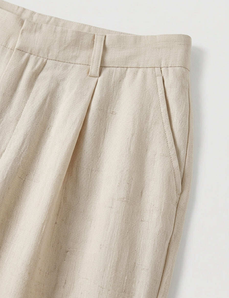 Close-up of beige pants on a white background