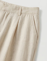 Close-up of beige pants on a white background