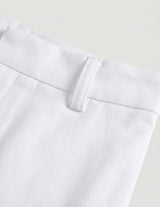 Close-up of white pants with a plain background