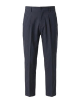 Dark blue men’s pleated tailored pants with belt loops and straight-leg silhouette