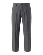 Dark gray men’s pleated dress pants with button closure and structured waistband