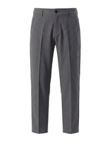 Dark gray men’s pleated dress pants with button closure and structured waistband
