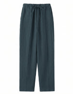 Dark green pants with a tie waist on a white background