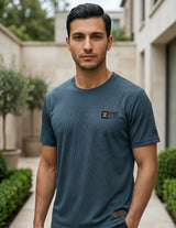 Front view of male model wearing a dark teal blue short-sleeve T-shirt with a relaxed casual fit.