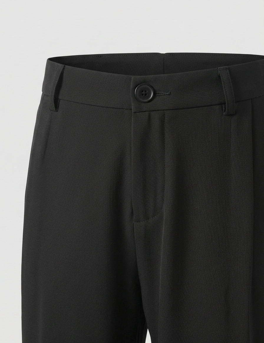 Graphite - Black pants with a button on a light gray background