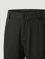 Graphite - Black pants with a button on a light gray background