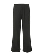 Graphite - Black wide-leg pants on a light gray background