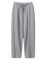 Gray drawstring relaxed-fit pants with straight legs on a white background.