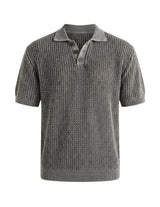 Gray knitted polo shirt on a light gray background