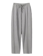 Gray pants with a drawstring on a white background