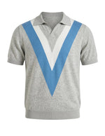 Gray sweater with blue and white V-shaped design on a light gray background