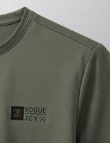 Green long-sleeve shirt with a logo on a gray background
