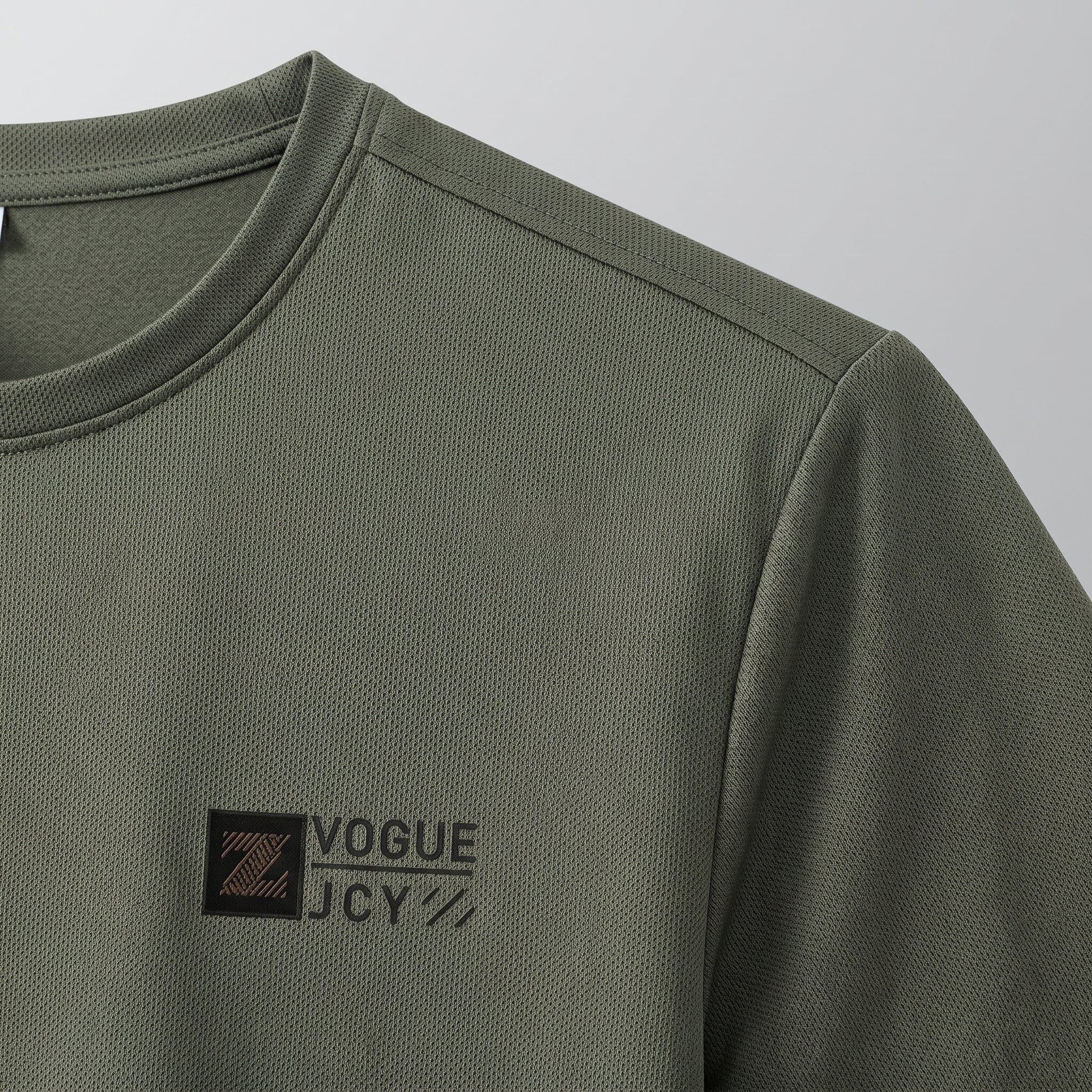 Green long-sleeve shirt with a logo on a gray background
