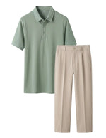 Green polo shirt and beige pants on a light gray background