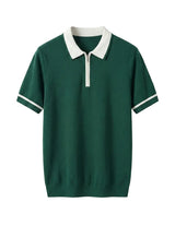 Green polo shirt with white collar and trim on a light gray background