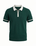 Green polo shirt with white collar and trim on a white background