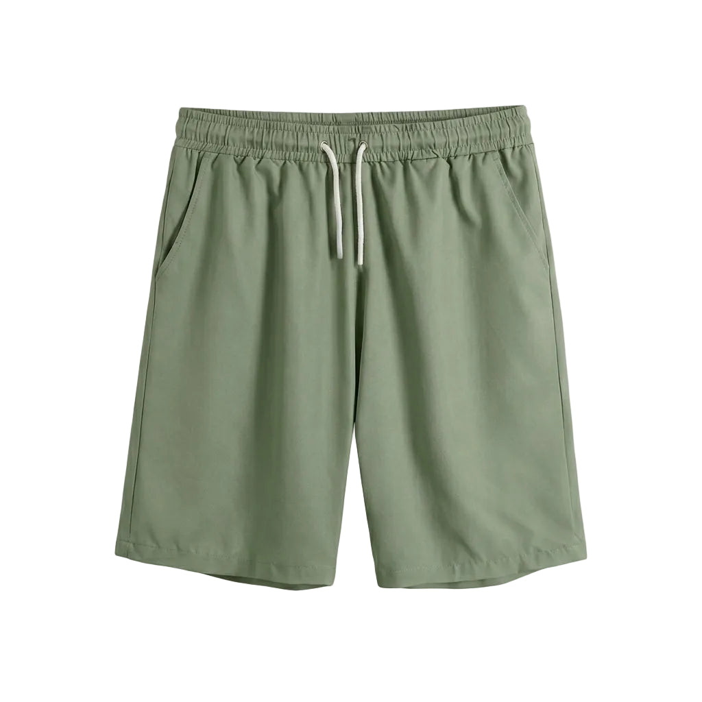 Green shorts with a drawstring on a light gray background