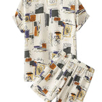 Ivory abstract print short-sleeve shirt with matching drawstring shorts on a white background.
