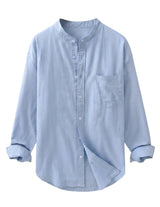 Light blue button-up shirt on a gray background