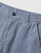 Light blue men’s relaxed waist trousers with clean straight fit close-up details