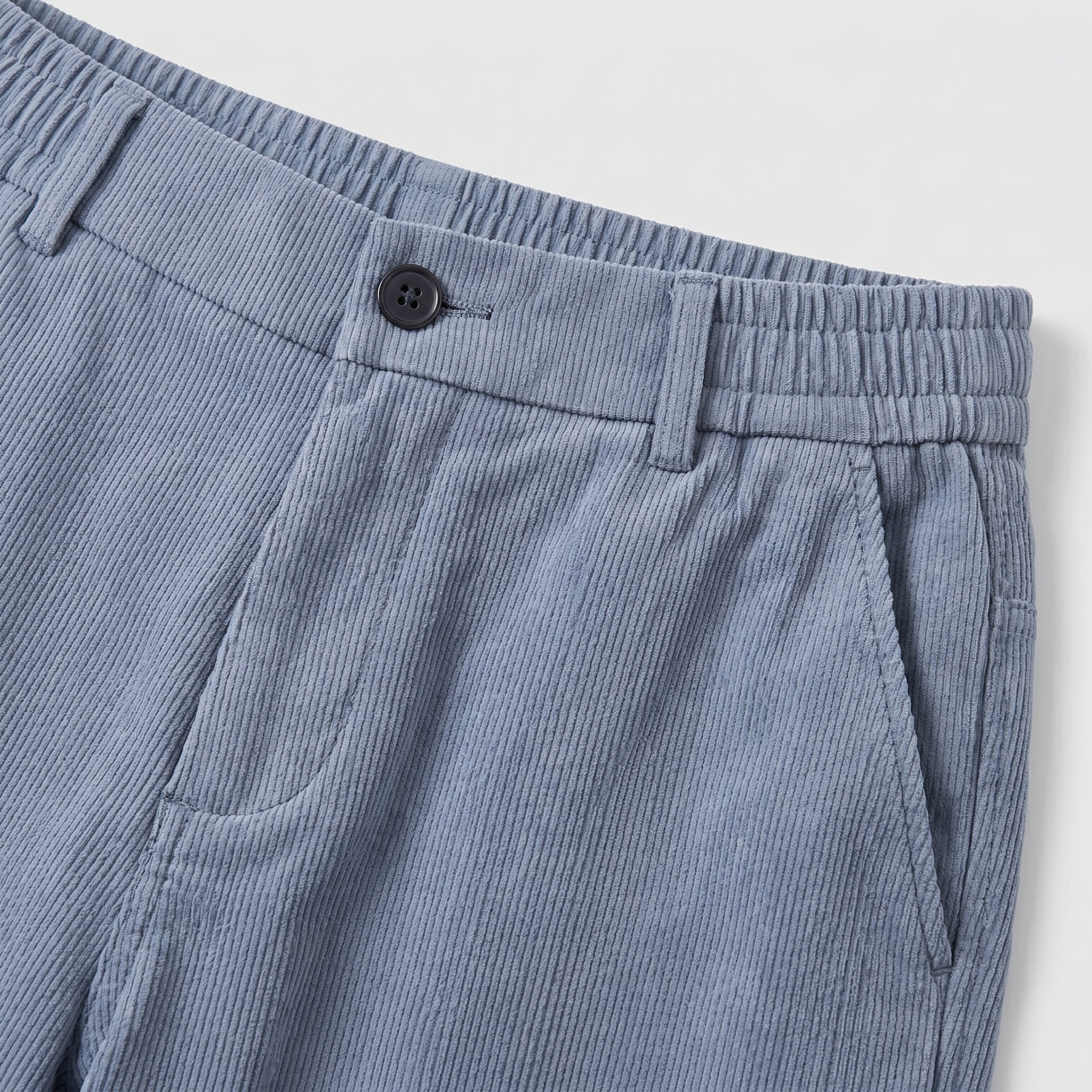 Light blue men’s relaxed waist trousers with clean straight fit close-up details