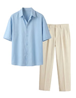 Light blue shirt and beige pants on a light gray background