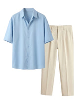 Light blue shirt and beige pants on a light gray background