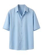 Light blue short-sleeve shirt on a light gray background
