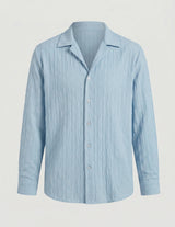 Light blue striped shirt on a gray background