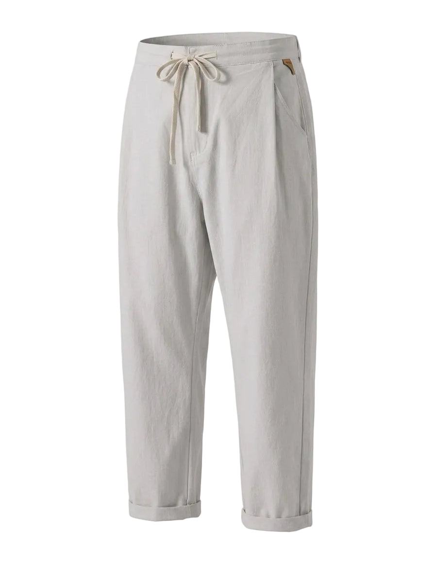 Light gray drawstring jogger pants with tapered legs on a white background.