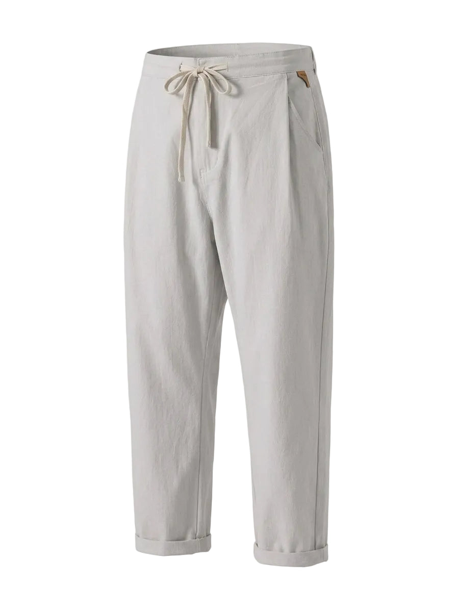 Light gray drawstring jogger pants with tapered legs on a white background.