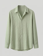 Light green button-up shirt on a light gray background