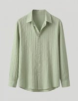 Light green button-up shirt on a light gray background