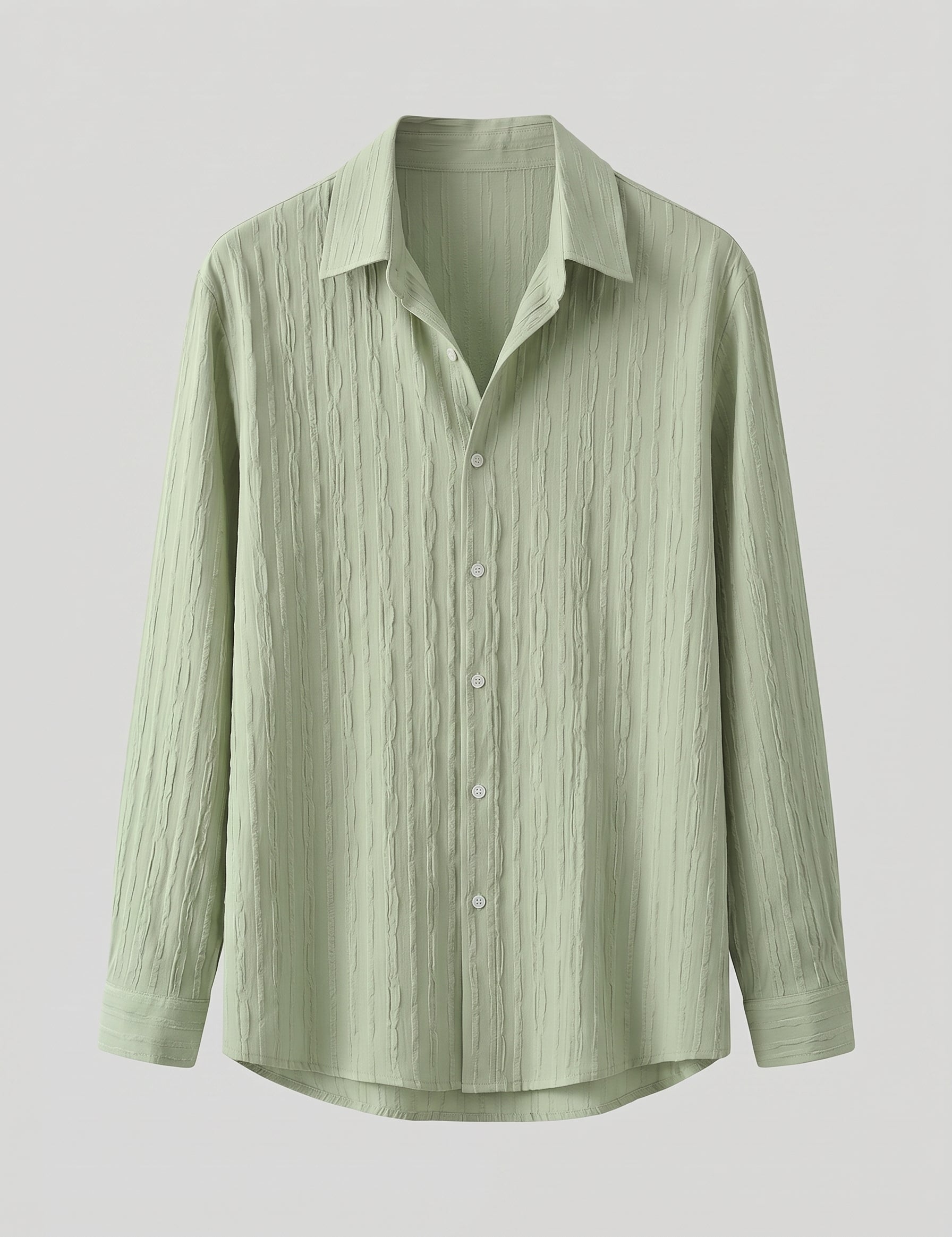 Light green button-up shirt on a light gray background