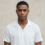Male model wearing a white short-sleeve button-up