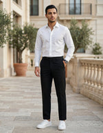 Man wearing a black men’s pleated tailored pants with clean front closure and straight fit