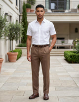 Man wearing a brown men’s pleated pocketed trousers with button waistband