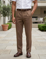 Man wearing a brown men’s pleated pocketed trousers with button waistband bottom