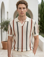 Man wearing a striped polo shirt in an outdoor setting