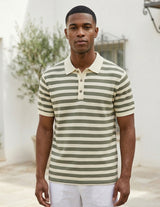 Man wearing a striped polo shirt standing outdoors with a neutral background