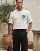 Cream white men’s cotton crew neck T-shirt with small chest graphic