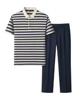 Navy and white striped polo shirt with navy pants on a white background