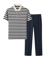 Navy and white striped polo shirt with navy pants on a white background