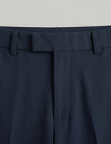Navy blue pants with a belt on a light gray background