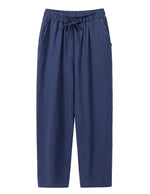 Navy drawstring relaxed-fit pants with straight legs on a white background.