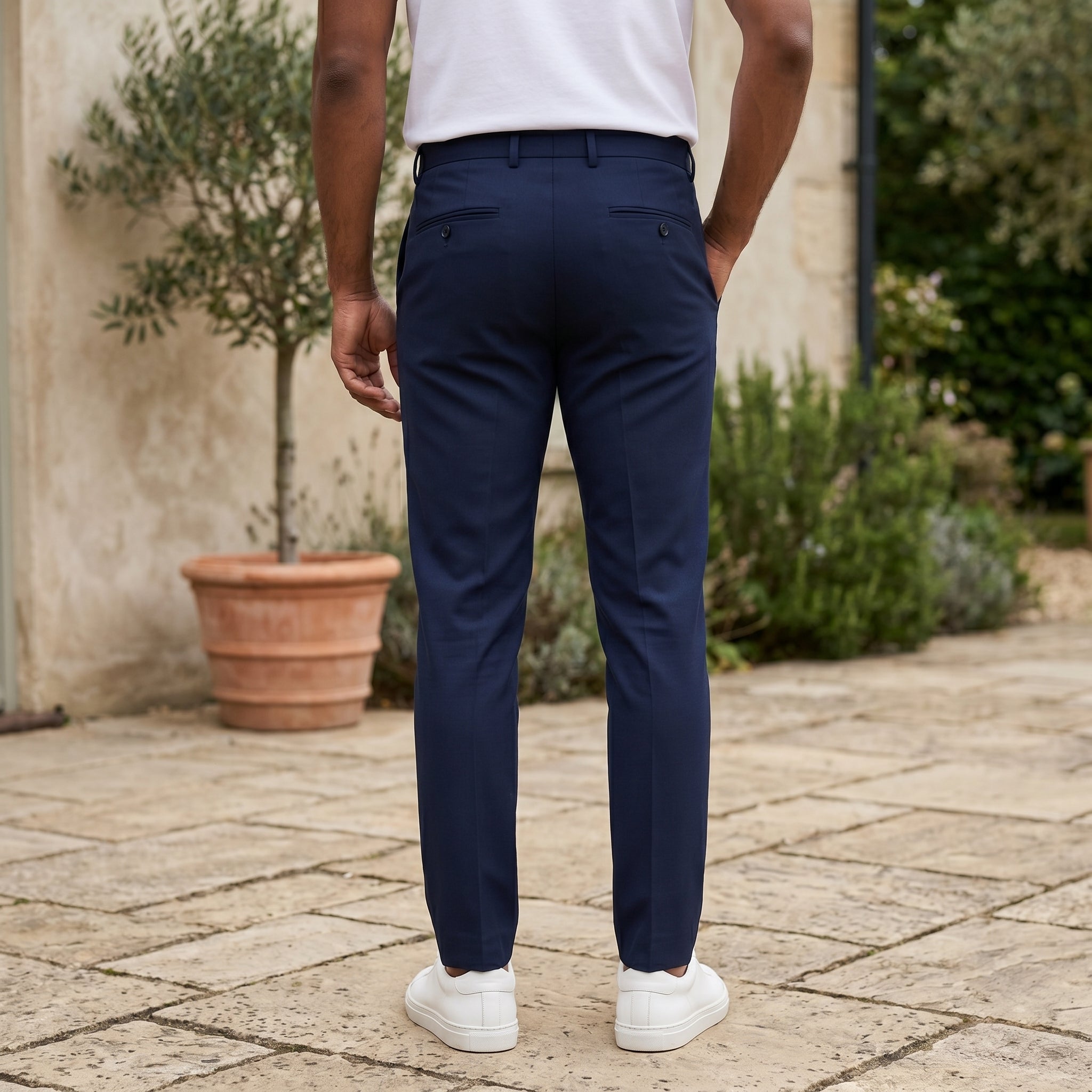 Navy men’s pocketed tailored trousers with clean straight fit back view
