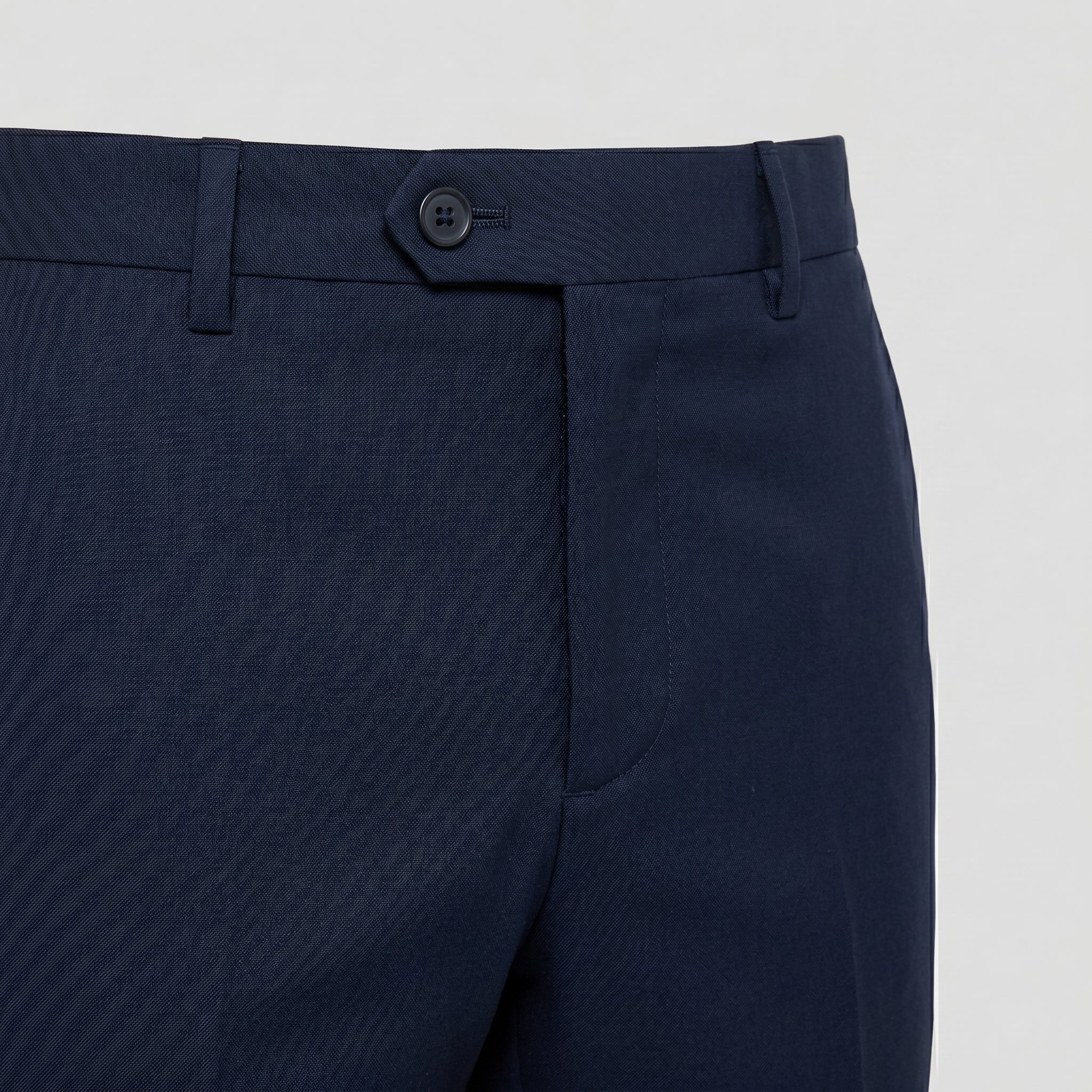 Navy men’s pocketed tailored trousers with clean straight fit closeup details