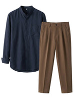 Navy shirt and brown pants on a light gray background