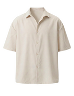 Off white short-sleeve shirt on a white background