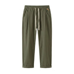 Olive green drawstring jogger pants with tapered legs on a white background.